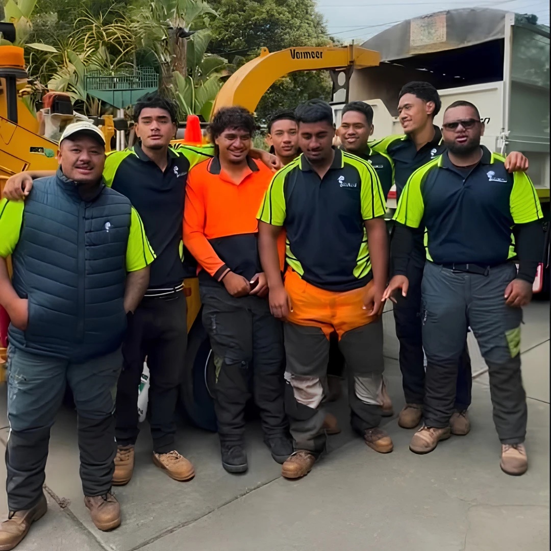 The Dan & Rob Tree Specialists crew in front of their Vermeer chipper and truck